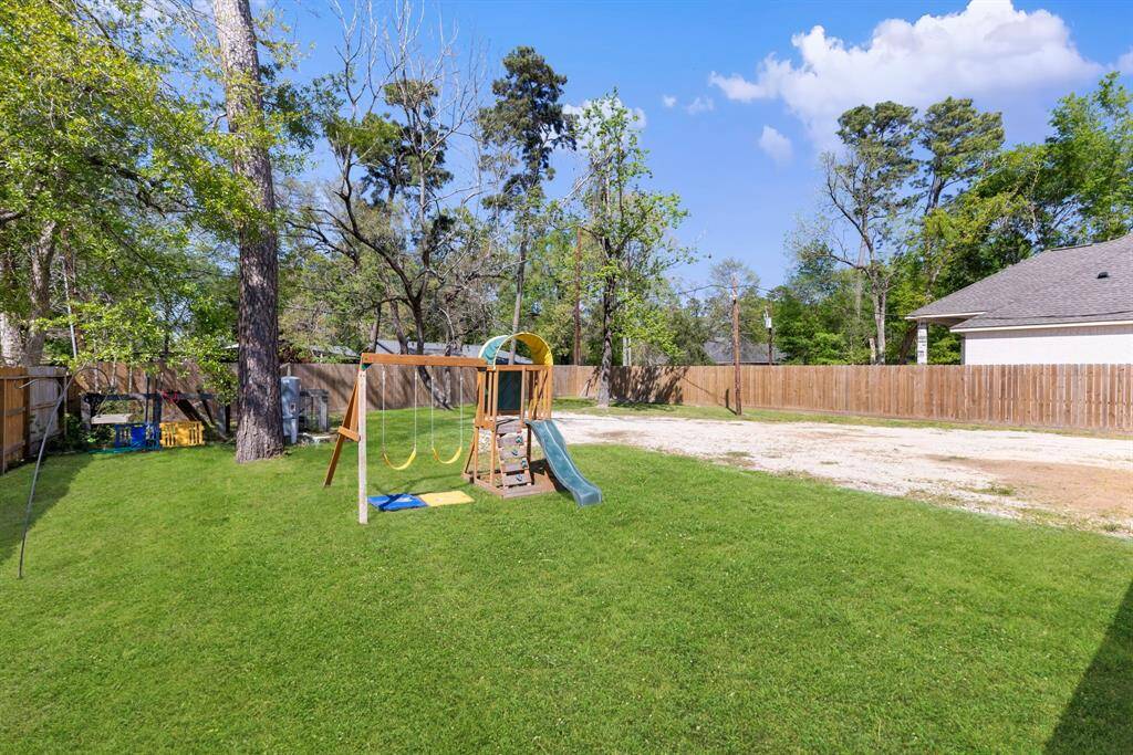 HUGE backyard with trees for privacy and a recent fence along the perimeter.