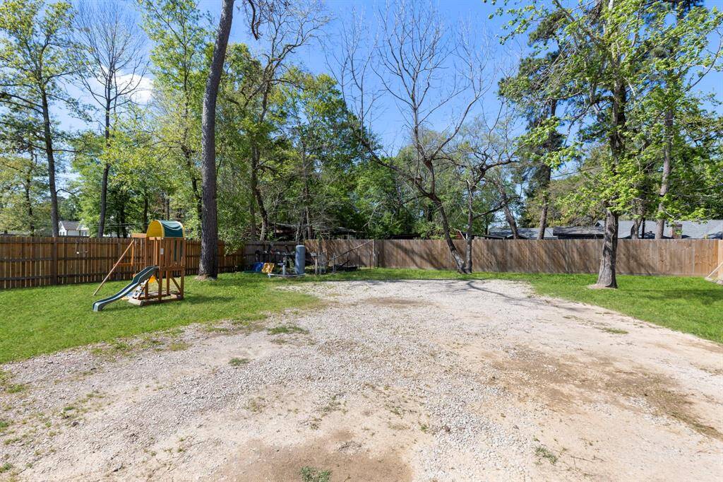 HUGE backyard with trees for privacy and a recent fence along the perimeter.