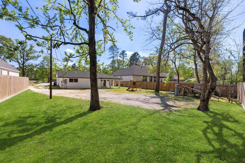 HUGE backyard with trees for privacy and a recent fence along the perimeter.