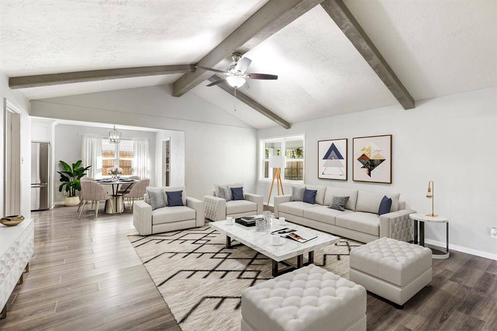 Large living room with vaulted ceiling. Virtually staged.
