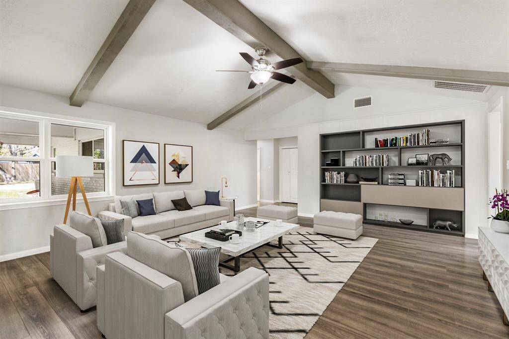 Large living room with vaulted ceiling. Virtually staged.