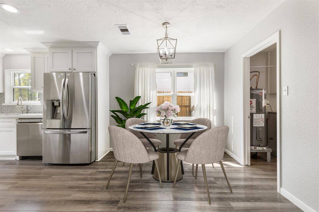 Breakfast room off of living room. Virtually staged.