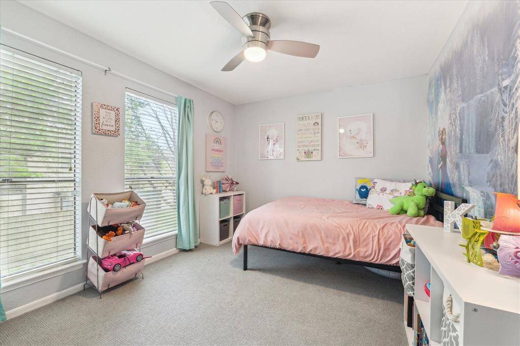 First guest bedroom upstairs with tons of natural light