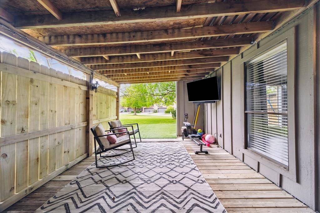 Covered back patio with new fence