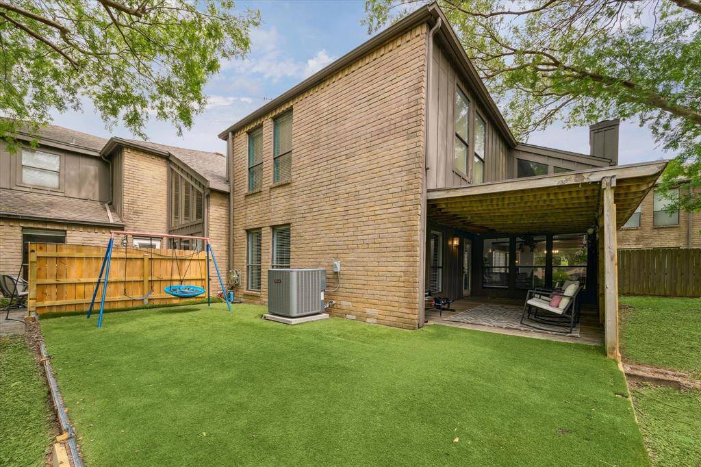 Open backyard with easy to maintain artificial grass