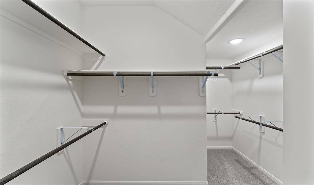 Walk-in closet in owner's suite (*Photo not of actual home and used for illustration purposes only.)