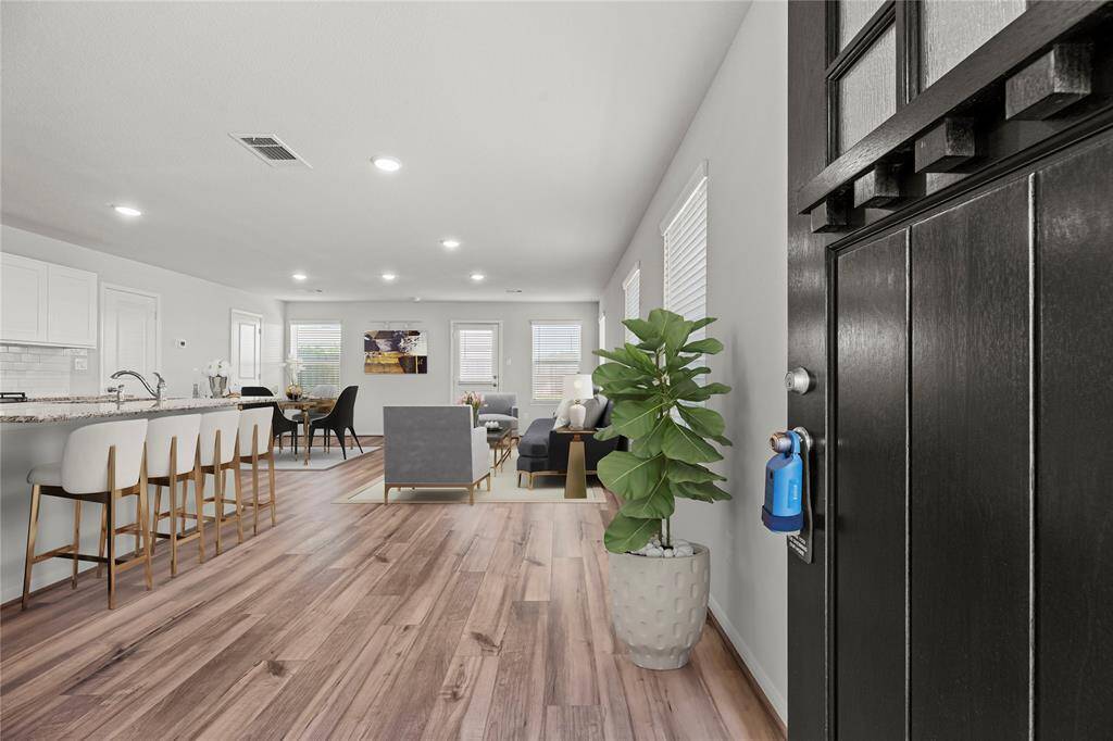 Step inside to a bright and invitingopen floor plan on the first level,seamlessly connecting the kitchen,dining area, and living room. Pleasenote: this photo has been virtuallystaged to offer ideas of what couldbe.
