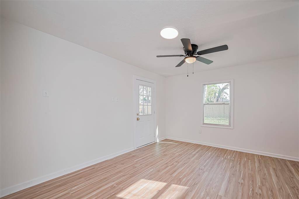 Alternate view of the primary bedroom looking into the backyard.