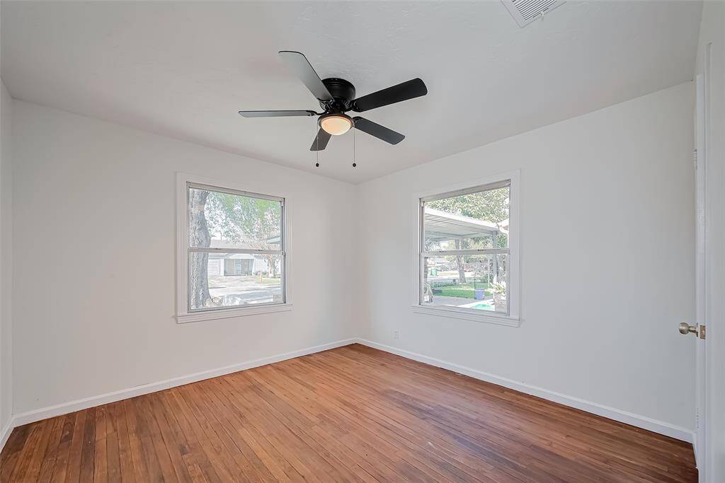 Secondary bedroom with a front yard view.