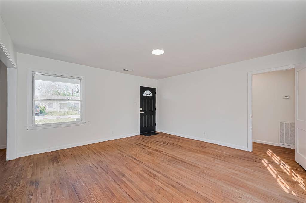 Alternate view of the living space onto the front door.