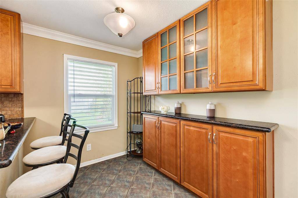 The breakfast area has a large built in buffet and storage cabinet.