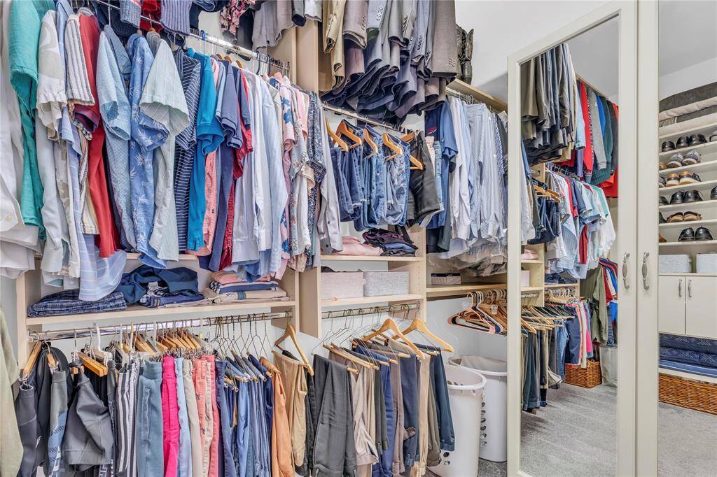 Primary Closet offers high a ceiling and buildout, allowing for 3 levels of Clothing Storage!
