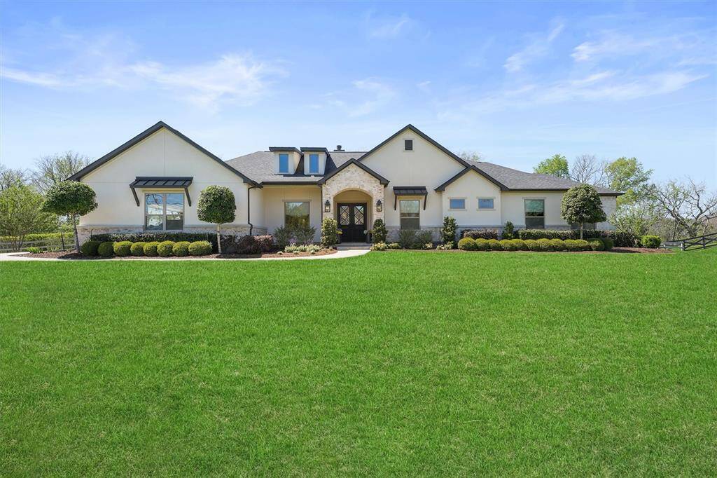 Welcome Home to 7211 Foster League, a custom built estate where comfort meets luxury.