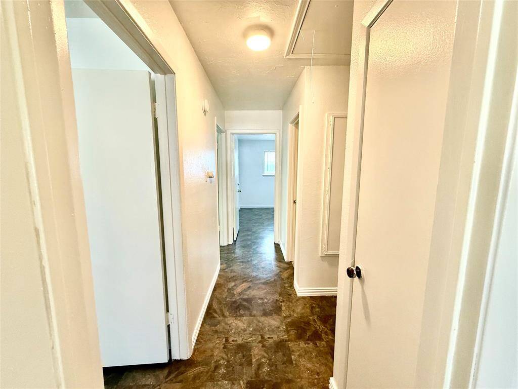 Welcoming hallway leading to cozy bedrooms.