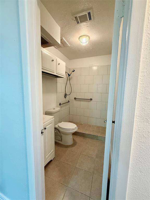 Modern secondary bathroom featuring a convenient step-in shower.