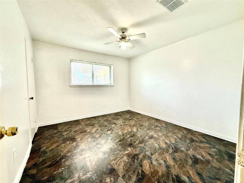 Enjoy serene views from Bedroom #3, overlooking the tranquil backyard.