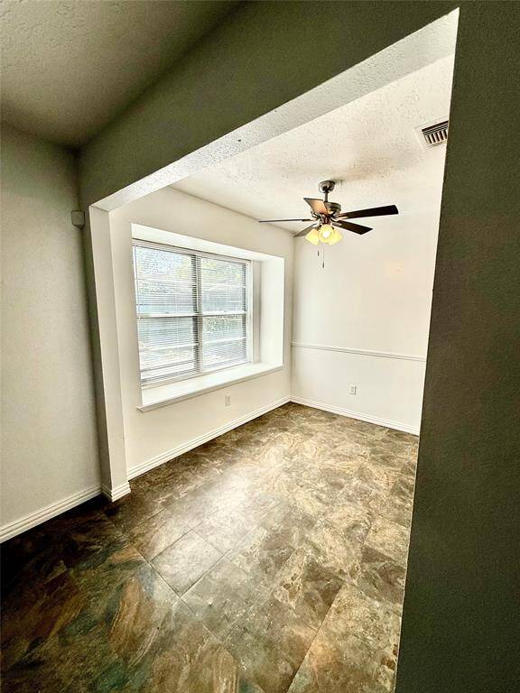 Cozy breakfast nook adjacent to the living room, perfect for morning light and casual dining.