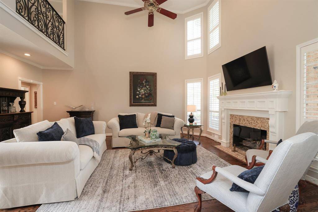 Gorgeous refinished wood floors and gas log fireplace add elegance to this room.