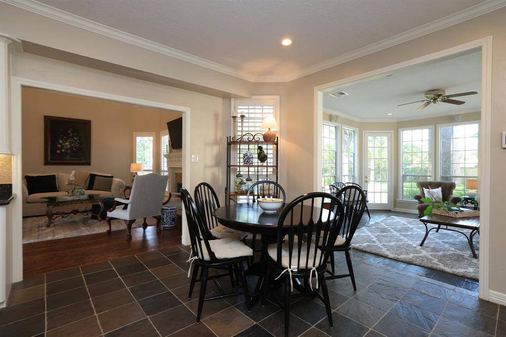 This view of the living room shows the door way in the back left side of the photos where the primary bedroom is located.