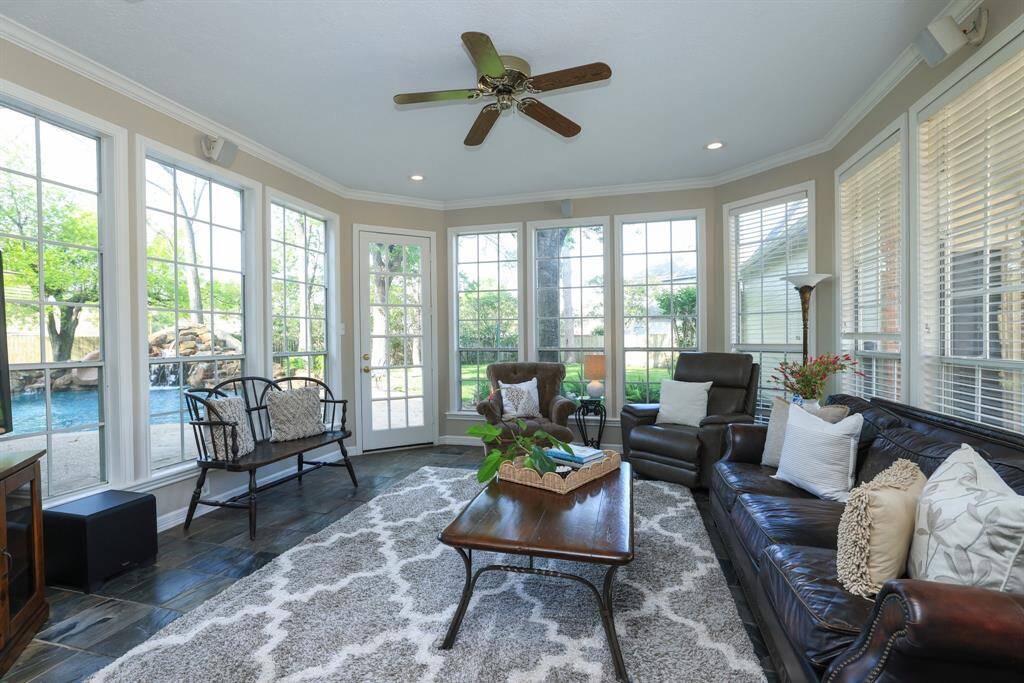 This view of the breakfast area shows the door to the driveway and garage as well as the sun room.