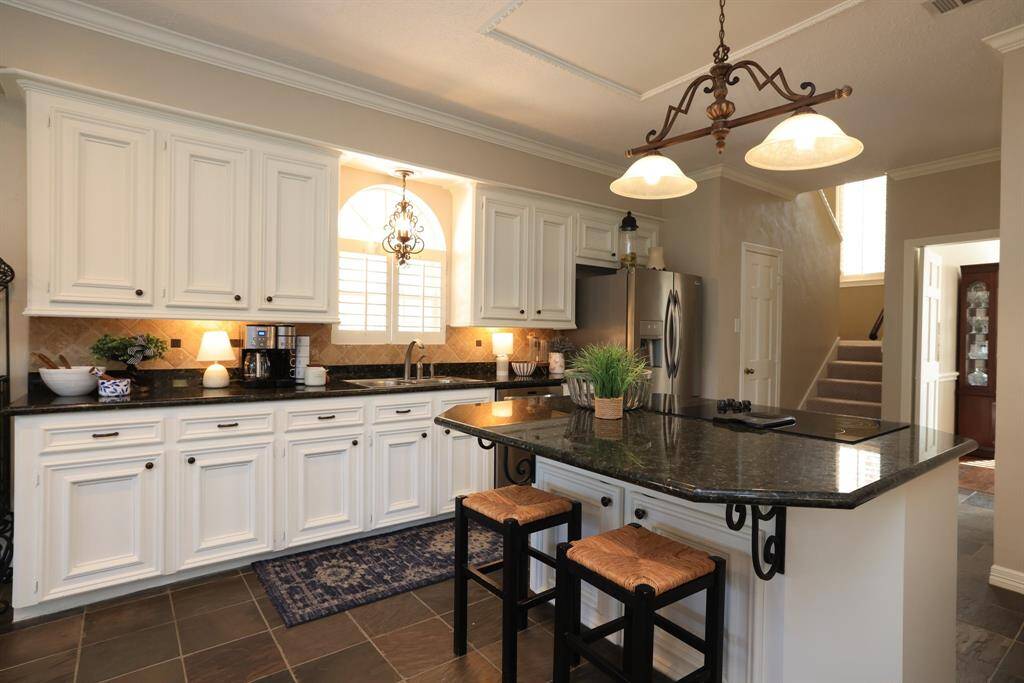 The kitchen is stunning with loads of cabinet space and granite counters.