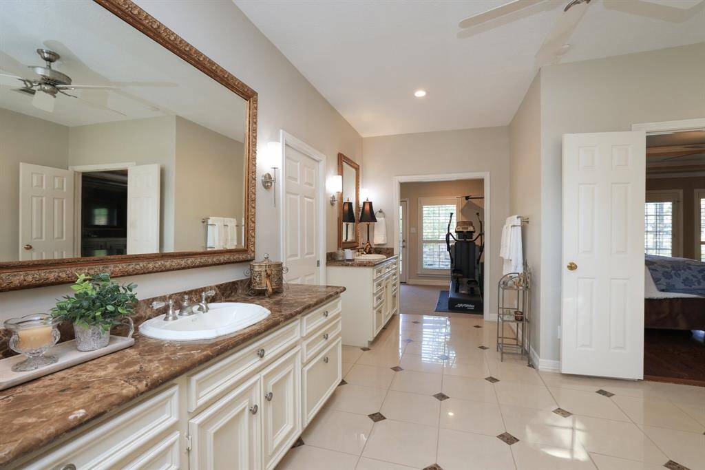 Primary bathroom was enlarged with additional space plus a closet and work out room.