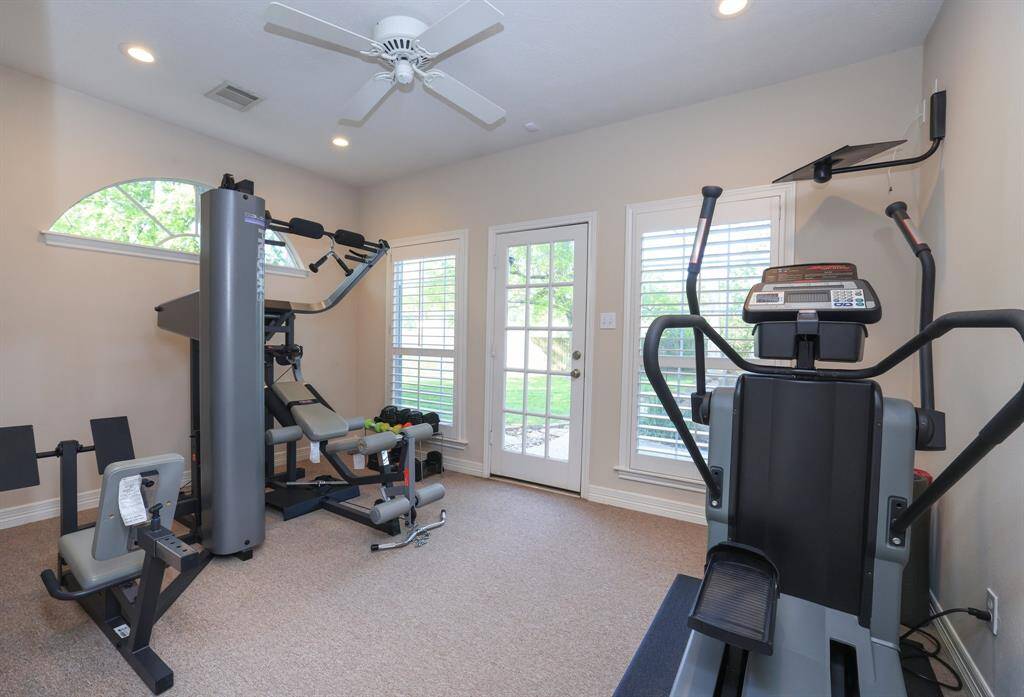 This amazing house has an additional work out room just off the primary bathroom.