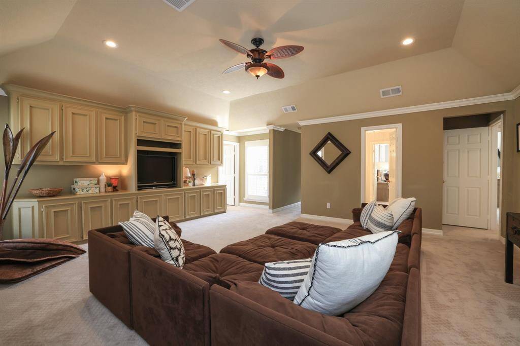 The second floor game room is large with the laundry room door in view. A fifth bedroom is shown to the left.