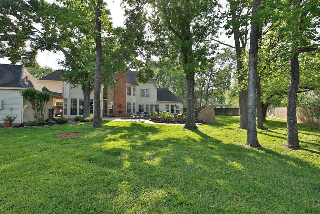No back yard neighbors and a huge half acre plus yard. A rare find in Champion Forest!