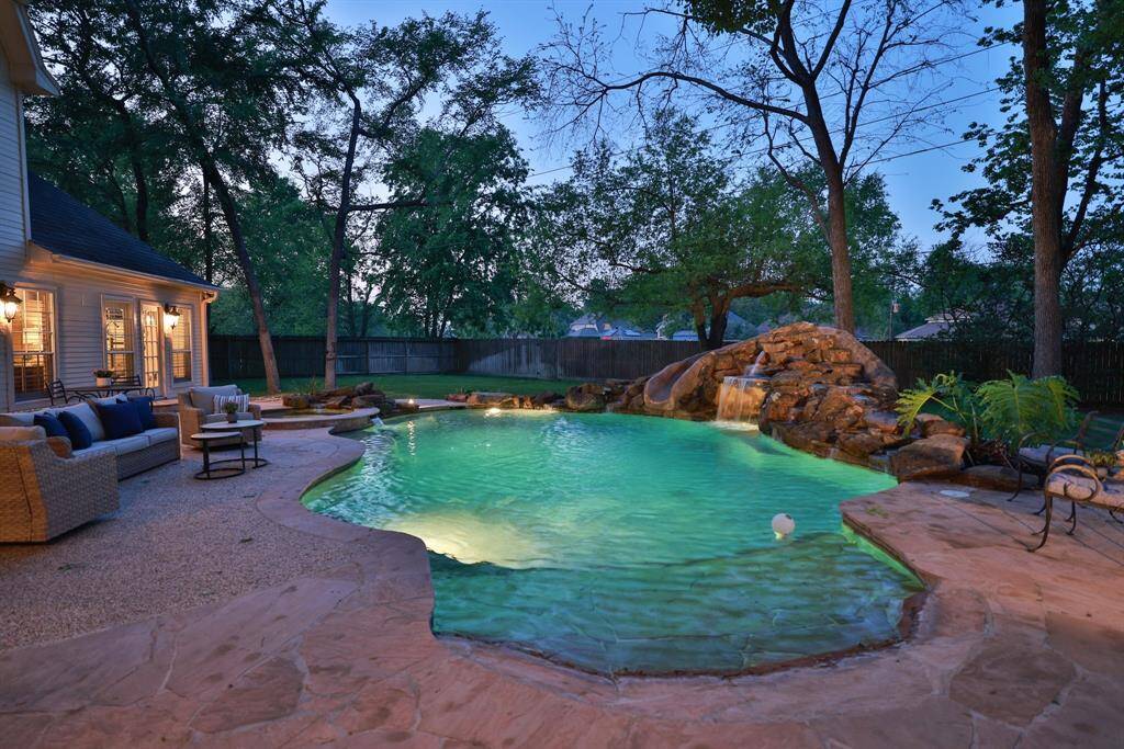 Another view of this fabulous treed back yard with a gate to the drainage gully behind the home.