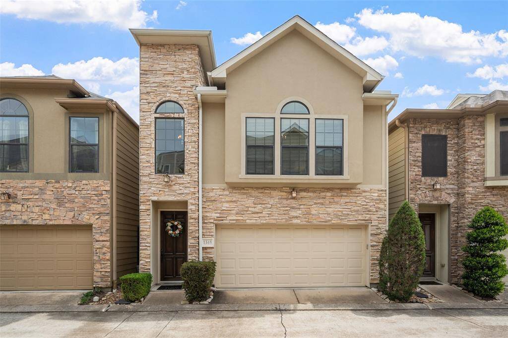 Stunning curb appeal! The front of 1345 Studer showcases elegant stonework, complemented by beautifully manicured bushes. Nestled within the gated community of Memorial Park Village, this residence offers both style and privacy.