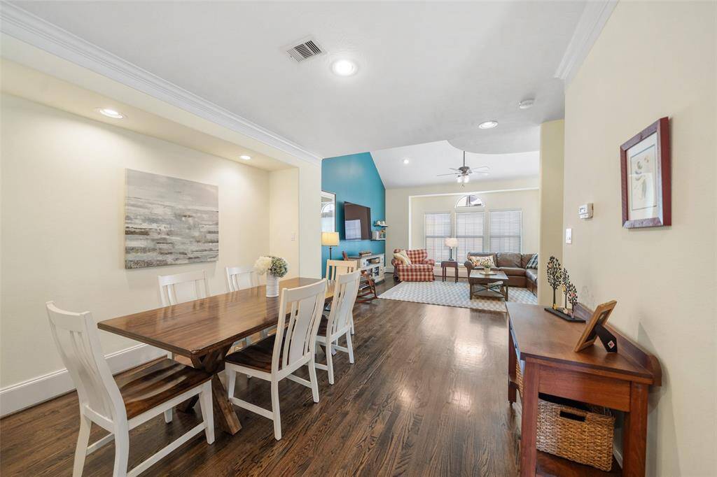 This centrally located dining room sits between the kitchen and the living room, offering easy access to both spaces.