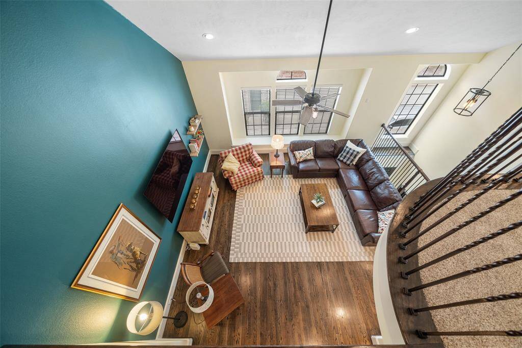 The loft offers views onto the living room below, creating an open and airy feel that enhances the home’s spacious layout
