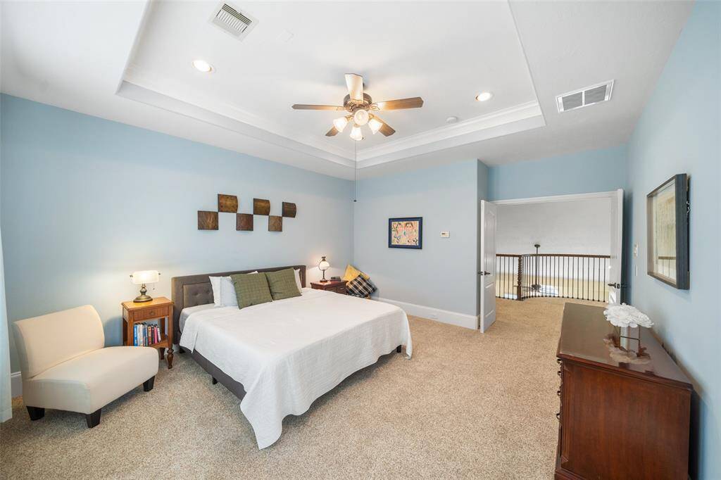The primary bedroom, located on the third floor, offers privacy as the only room on this level, providing a peaceful retreat.
