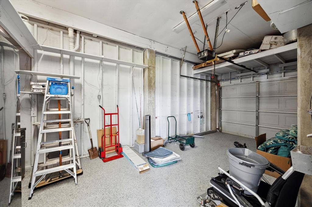 freshly painted walls and flooring for storage area off of garage
