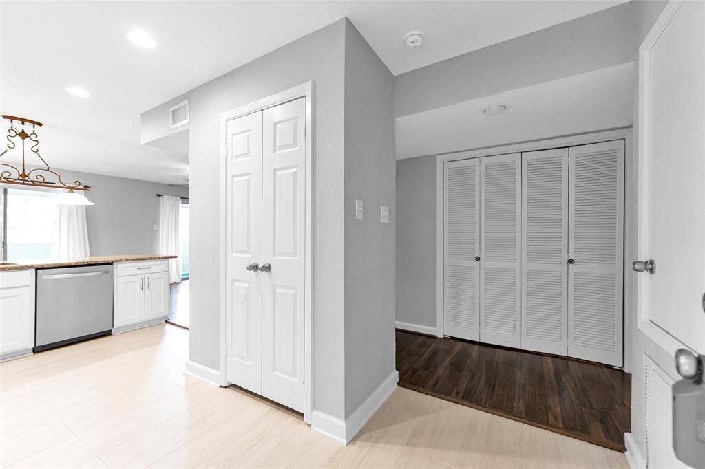 Washer/dryer is behind the folding doors in the hallway