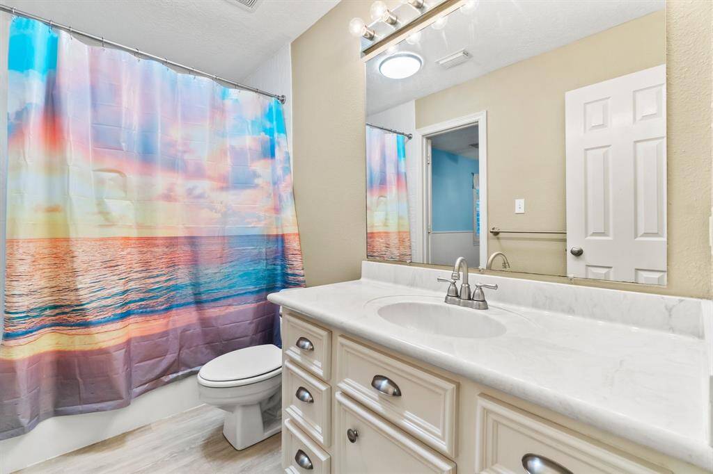 Secondary bathroom with hallway access as well.