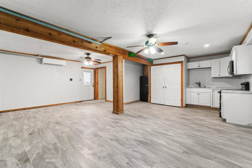 Kitchen, full bathroom and laundry area.