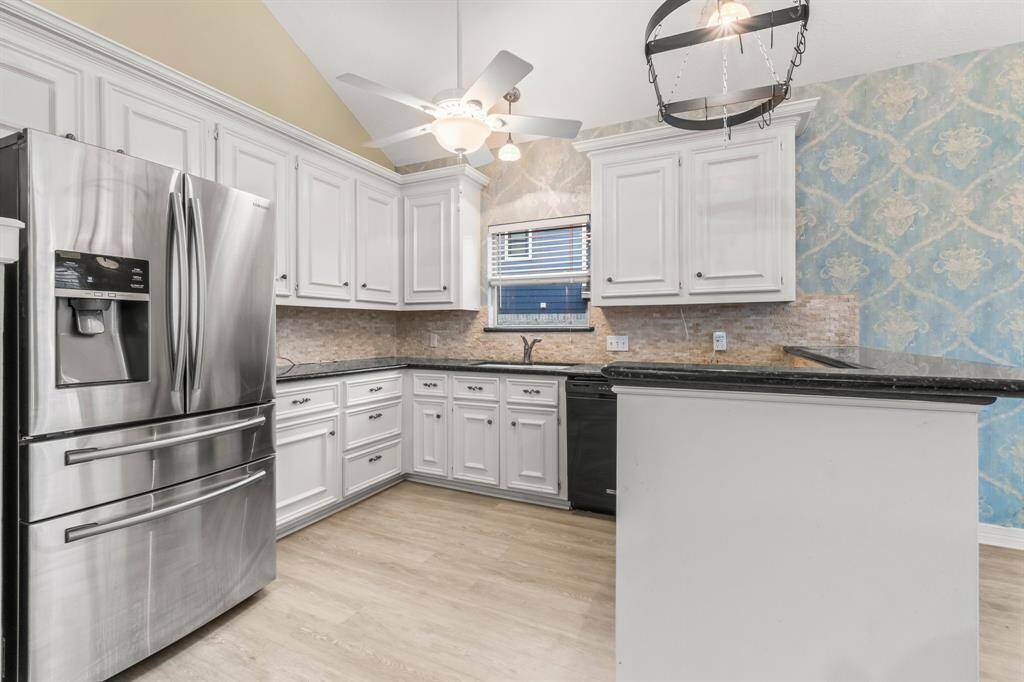 Open kitchen with lots of counter and cabinet space.