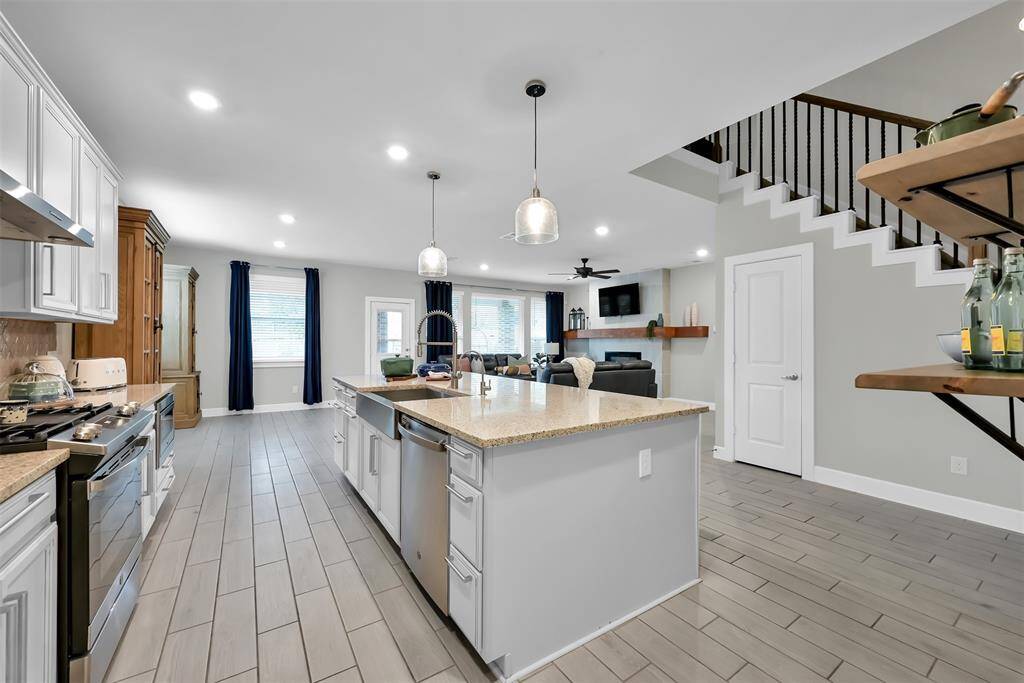 Additional features include a kitchen drinking water filtration system and upgraded garbage disposal.