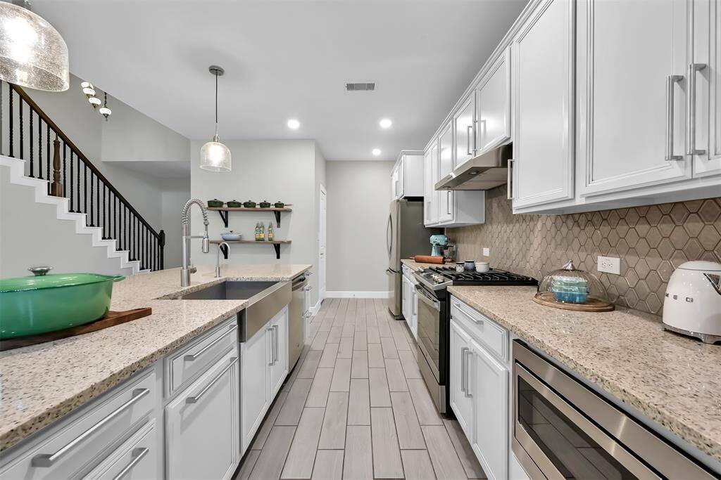 Cabinets feature custom hidden drawers to maximize space