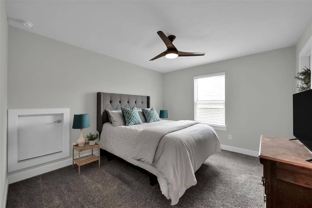Secondary bedroom 1 features a private bath and walk-in closet