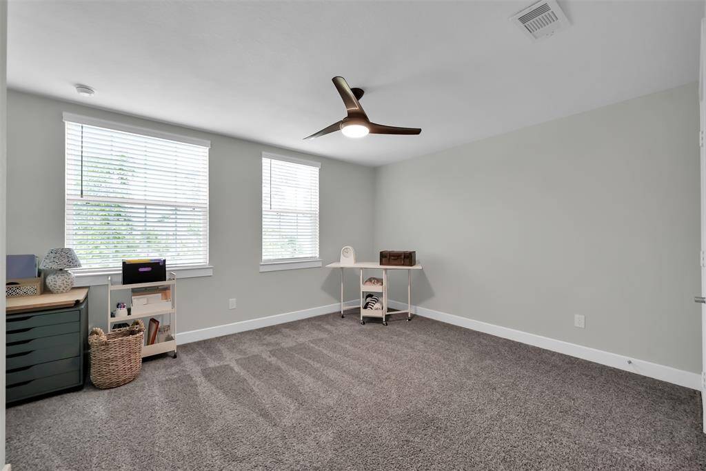 Secondary bedroom 3 features a walk-in closet, and quick access to the shared bath