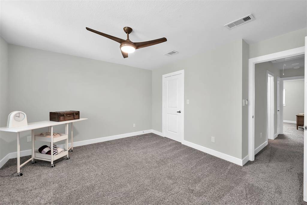 Secondary bedroom 3 features a walk-in closet, and quick access to the shared bath