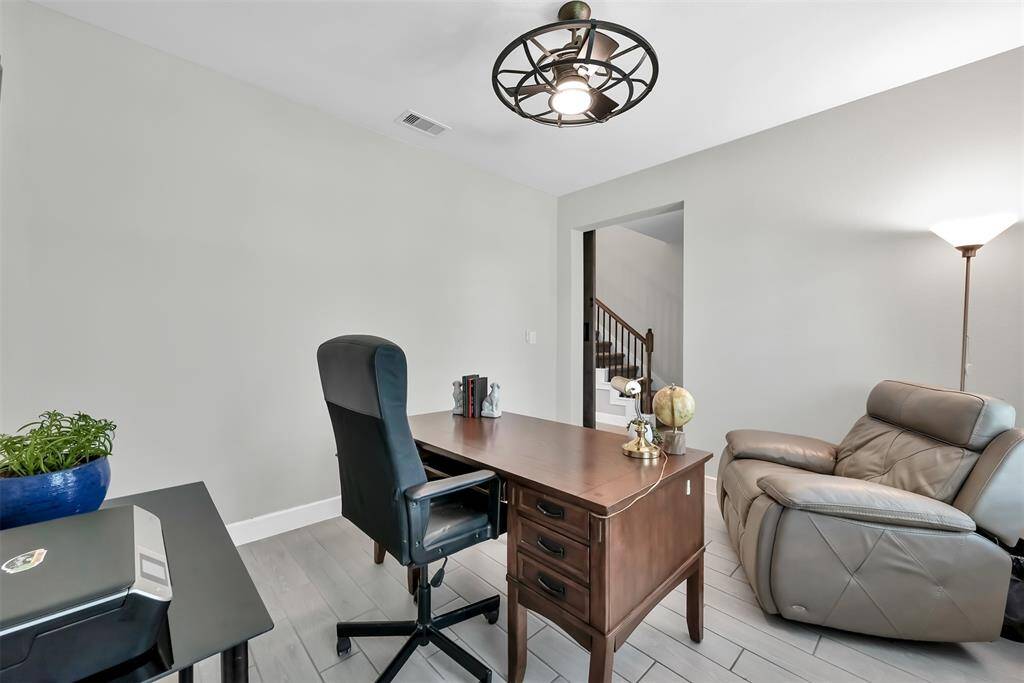 This spacious room features a custom barn-style door for added privacy.