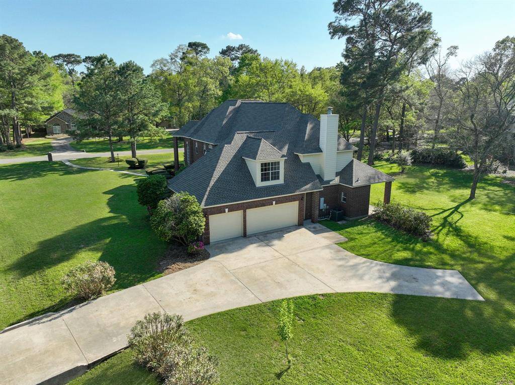 Easy turn in to or out of the three car garage from driveway entering directly from street. The home is located on a beautiful corner cul-de-sac property
