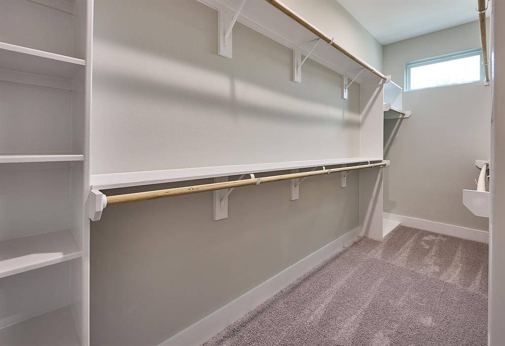 Walk-in closet in the Primary Bedroom