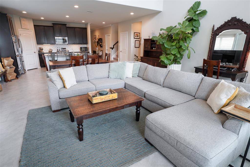 Here standing in the living room you are able to see all of the natural light and space this beautiful home provides.