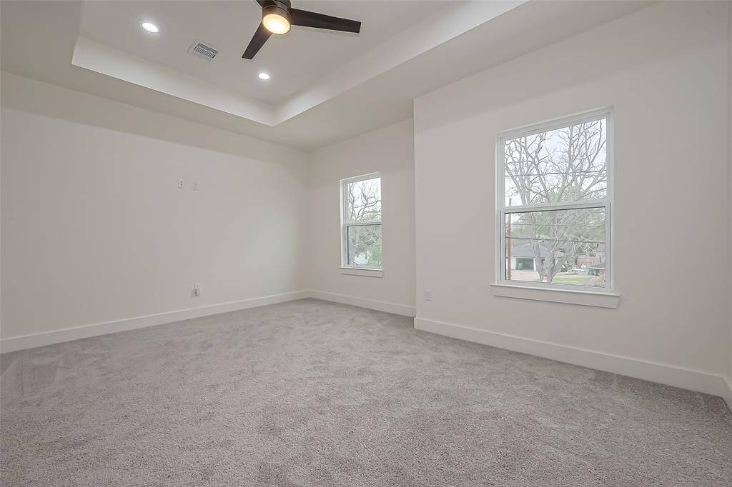 Primary suite with tray ceiling and ensuite bath