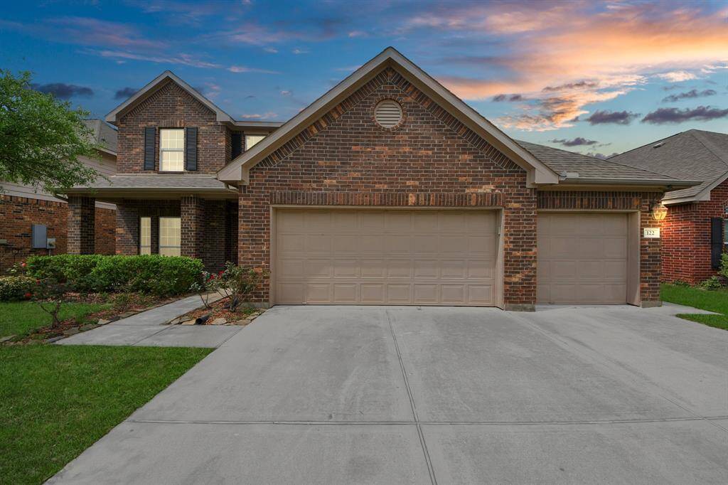 Beautiful brick covered 2 story home with that extra porche space for a bench.